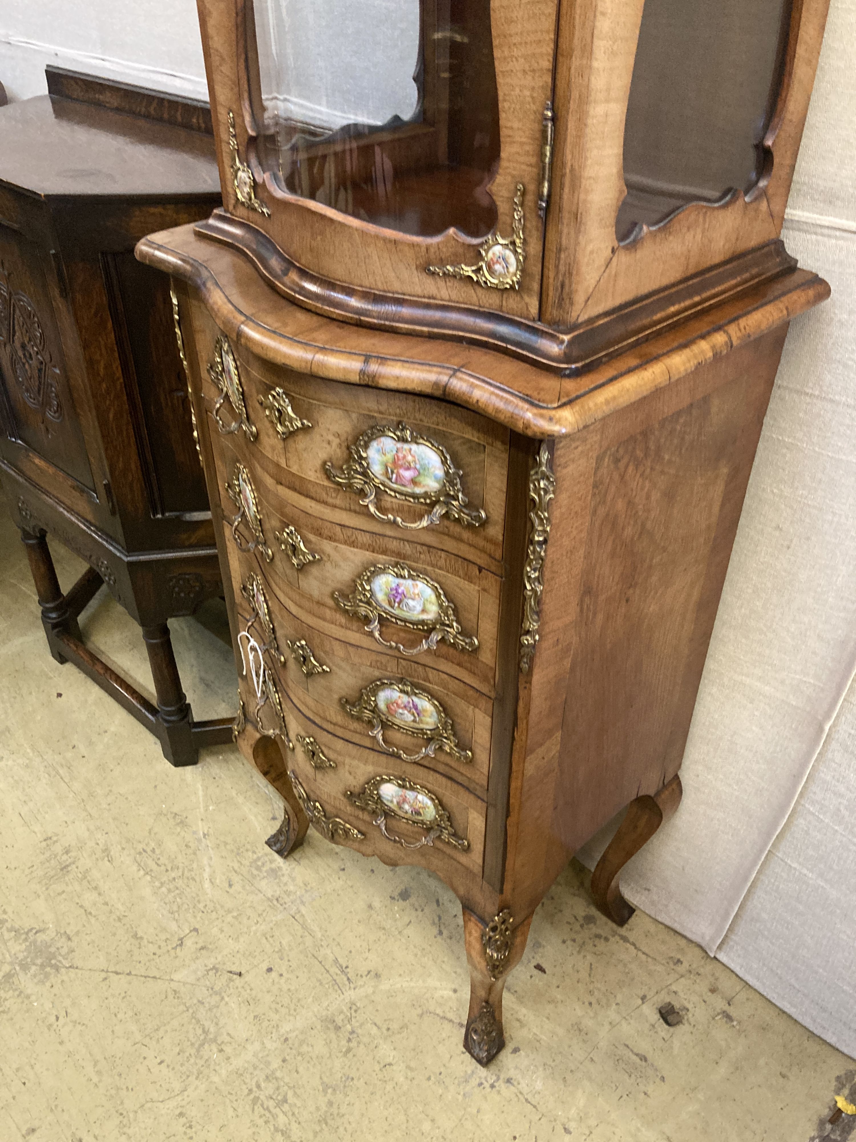 A small Louis XV style kingwood and walnut serpentine vitrine on commode base, width 49cm, depth 40cm, height 146cm